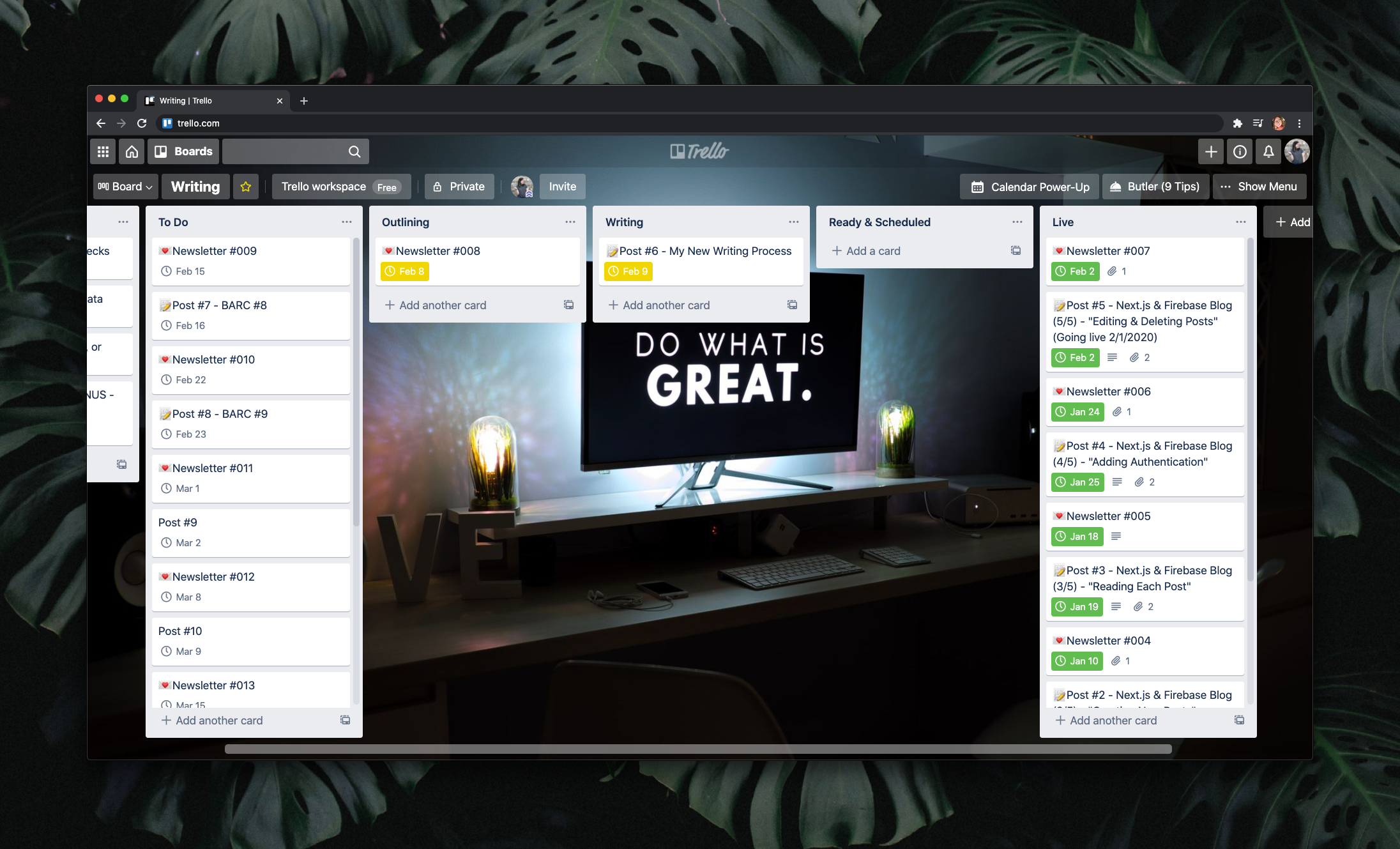 Trello board showing 5 columns: To Do, Outlining, Writing, Ready & Scheduled, and Live. The background of the board is a desk in a dark room with a computer screen that reads "Do what is great."